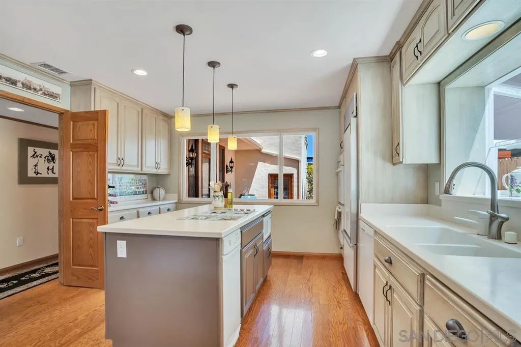26 The Point Coronado, CA 92118 - Photo 8 of 23 a kitchen with a sink stove and cabinets