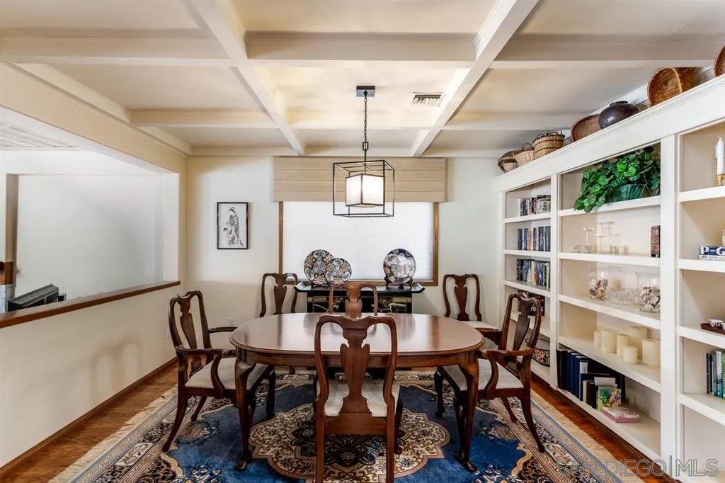 26 The Point Coronado, CA 92118 - Photo 10 of 23 a view of a dining room with furniture and a book shelf