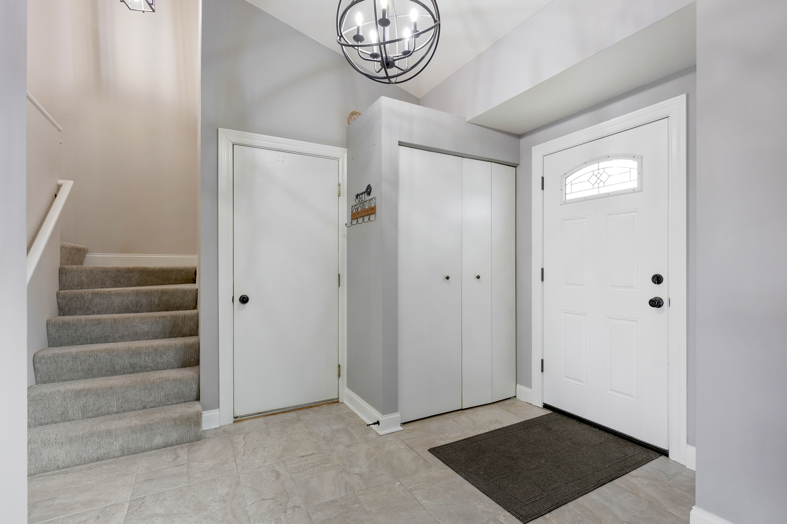 1032 Willow Bay Elgin, IL 60123 - Photo 2 of 27 a view of an entryway with a chandelier