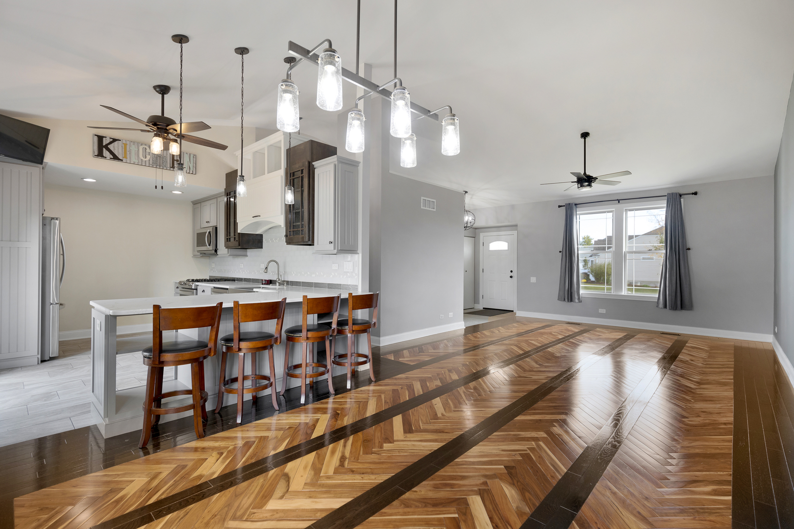 1032 Willow Bay Elgin, IL 60123 - Photo 6 of 27 a large kitchen with a table and chairs