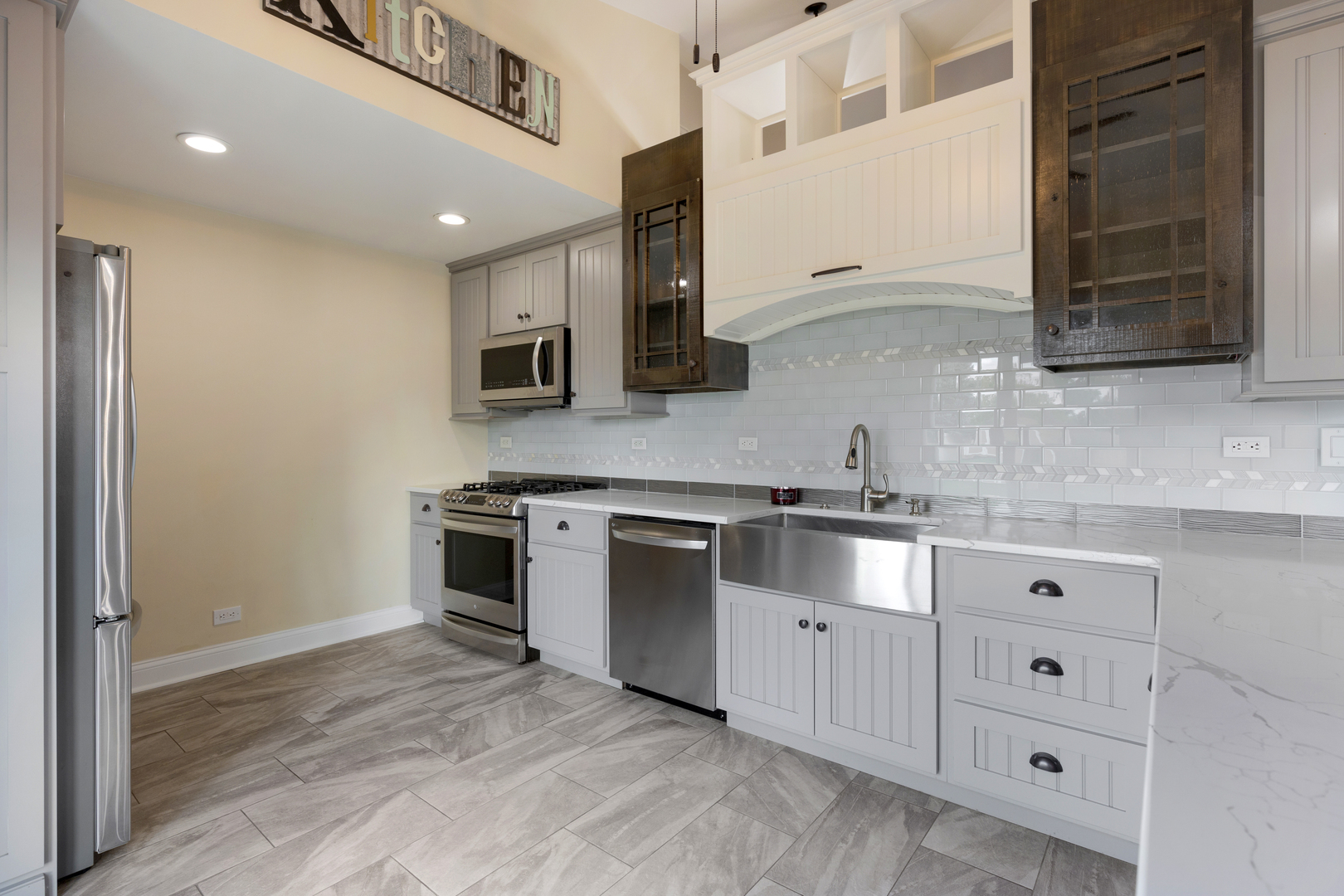 1032 Willow Bay Elgin, IL 60123 - Photo 9 of 27 a kitchen with stainless steel appliances granite countertop a stove and a sink