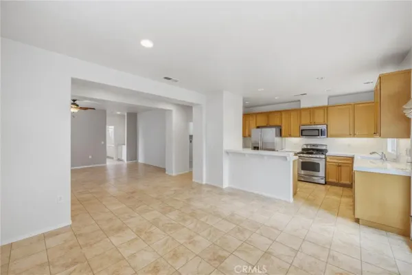 a kitchen with stainless steel appliances granite countertop a sink and cabinets