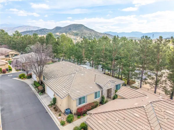 an aerial view of a house with yard