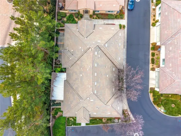 a tennis court that has trees in front of it