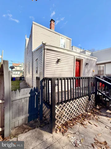a view of a house with a yard and garage