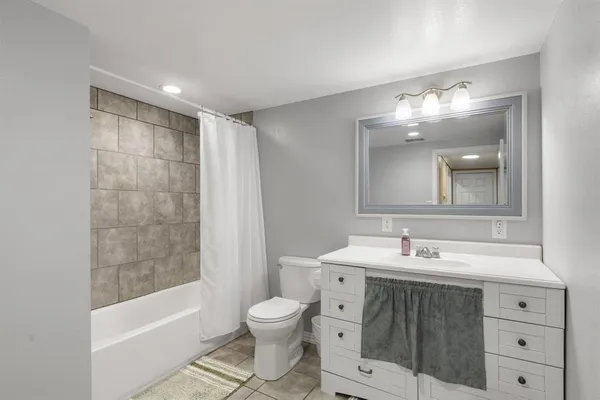 a bathroom with a shower and a bathtub