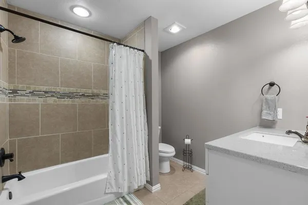 a bathroom with a sink vanity and a mirror