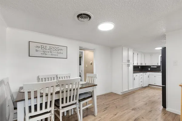 a view of kitchen with stainless steel appliances refrigerator and microwave
