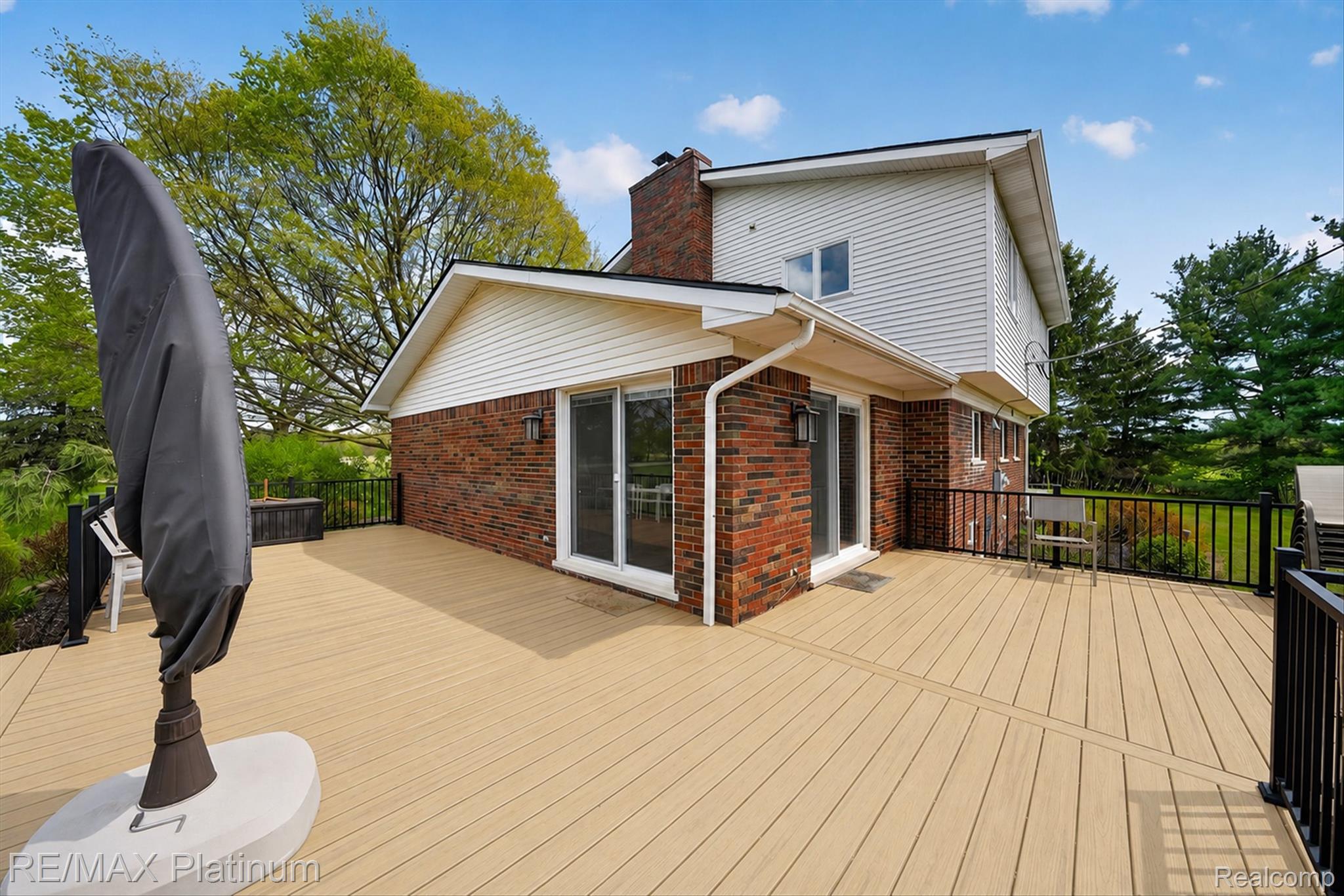7687 Parshallville Road Fenton, MI 48430 - Photo 13 of 15 Substantial rear deck that provides additional outdoor living space