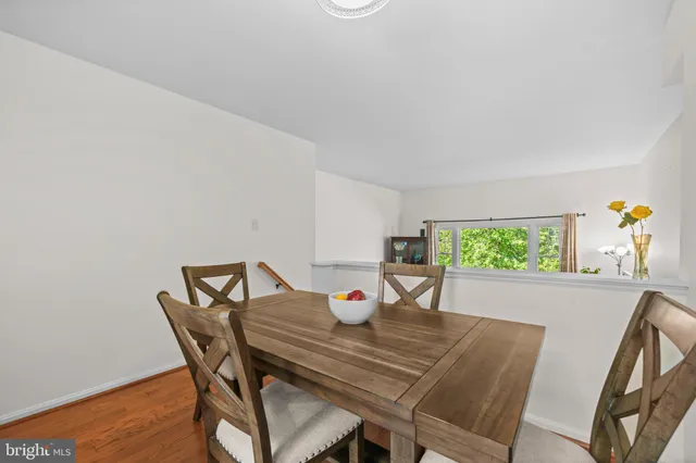 a view of a dining room that has a table and chairs in it