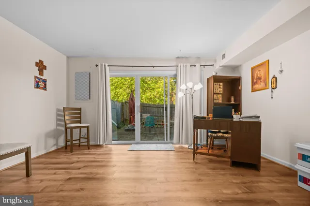 a view of a livingroom with furniture window and wooden floor