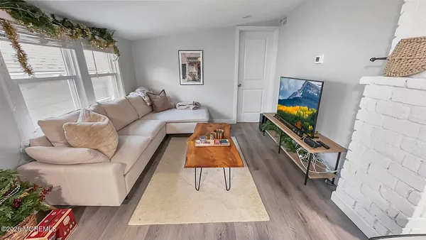 a living room with furniture and a rug