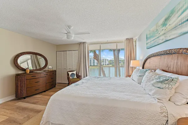 a bed room with a bed and a dresser