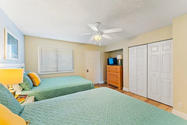 a bedroom with a bed and cabinets