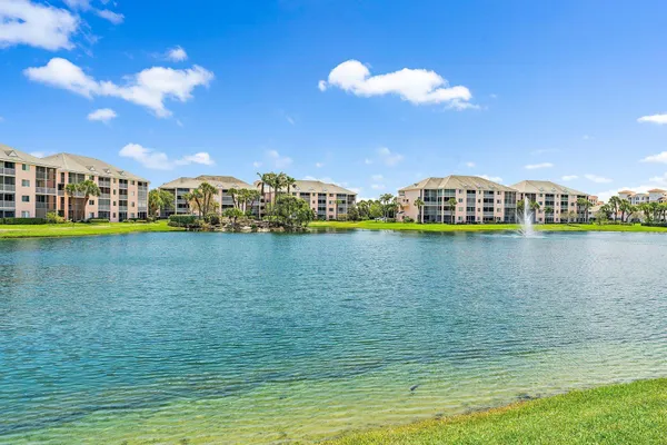 a view of a lake with houses in the background