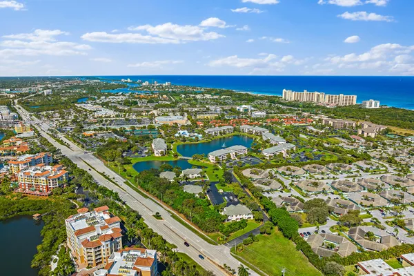 a view of a lake with houses in the back