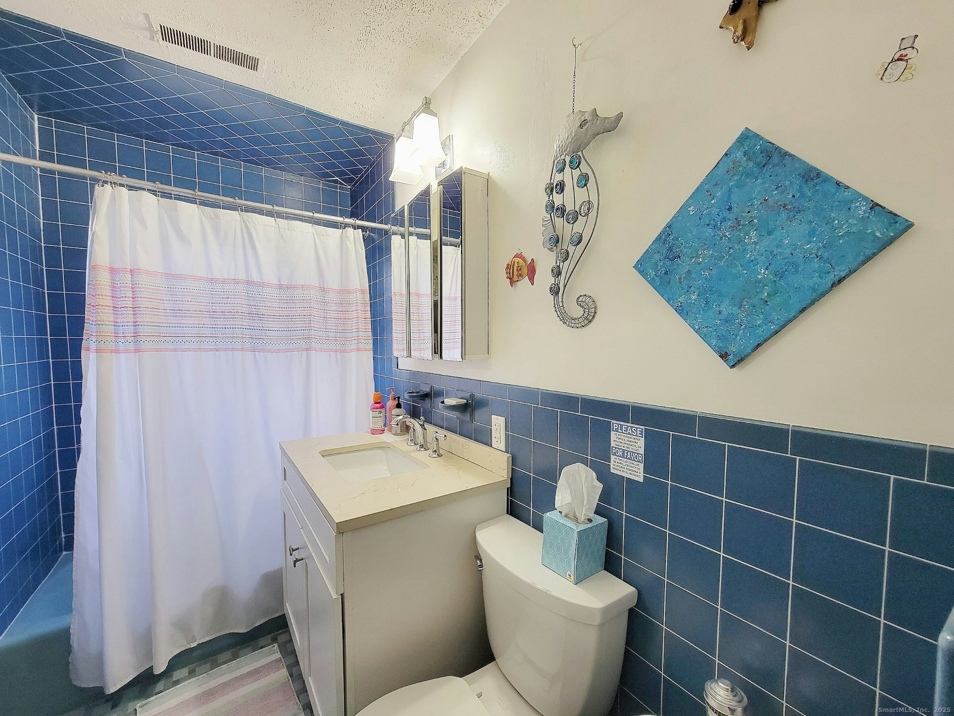 4 Candlewood Knolls Road New Fairfield, CT 06812 - Photo 12 of 21 a bathroom with a toilet sink and mirror