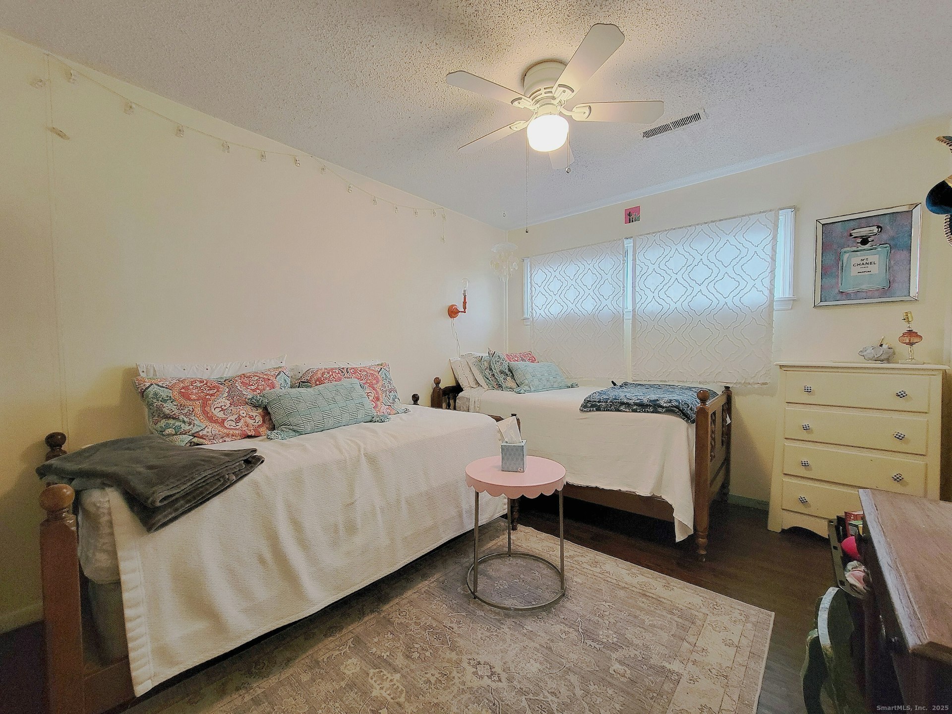 4 Candlewood Knolls Road New Fairfield, CT 06812 - Photo 14 of 21 a bedroom with a bed and a chandelier