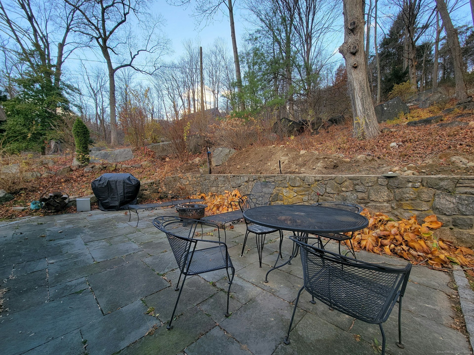 4 Candlewood Knolls Road New Fairfield, CT 06812 - Photo 17 of 21 a backyard of a house with table and chairs