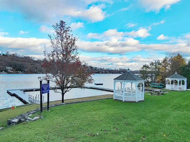 a view of a house with a yard porch and sitting area
