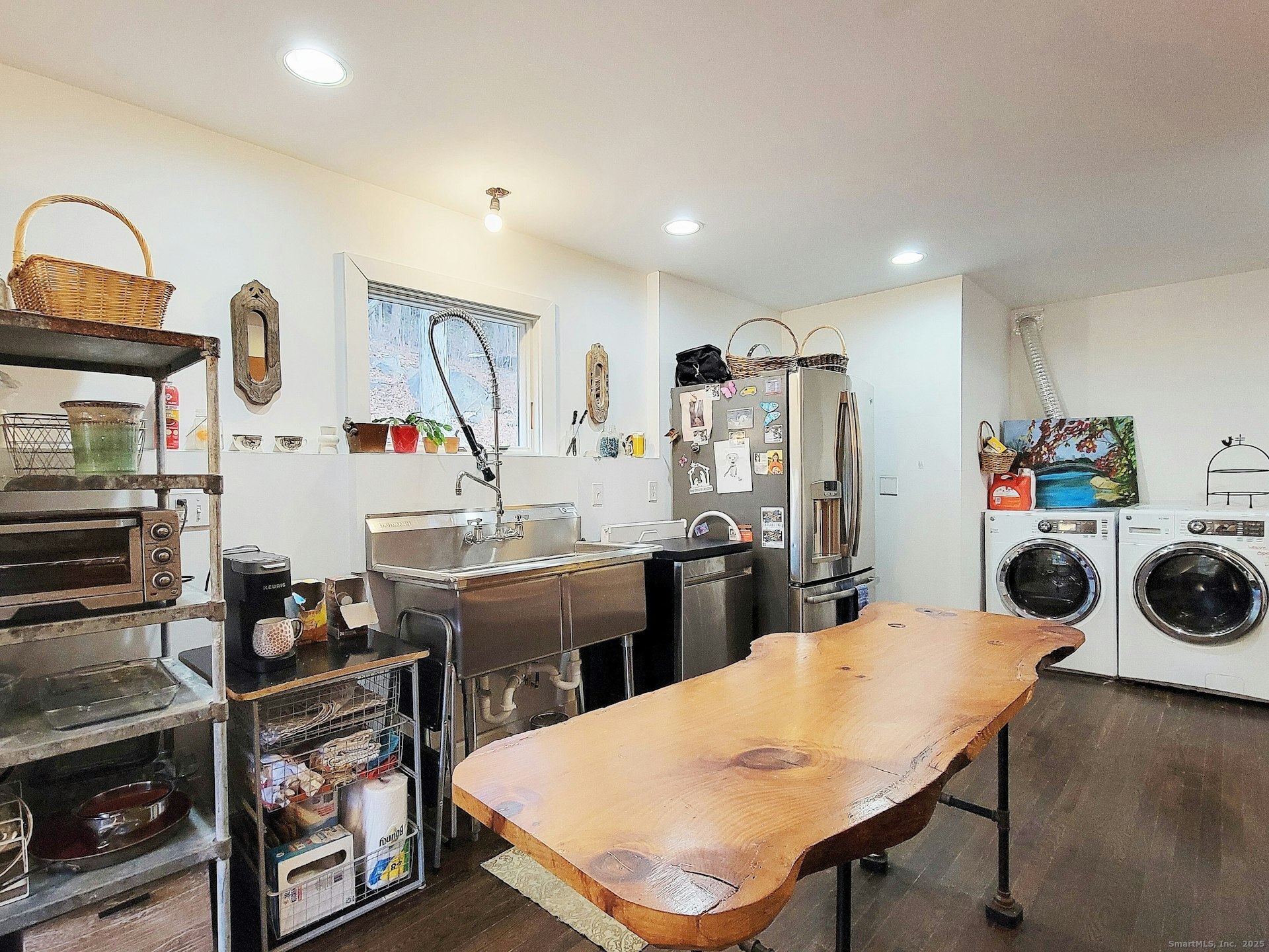 4 Candlewood Knolls Road New Fairfield, CT 06812 - Photo 8 of 21 a kitchen with stainless steel appliances kitchen island a table chairs stove and refrigerator