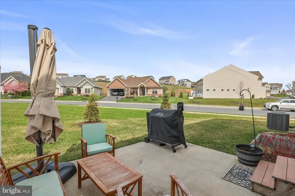 a view of a two chairs in a big yard