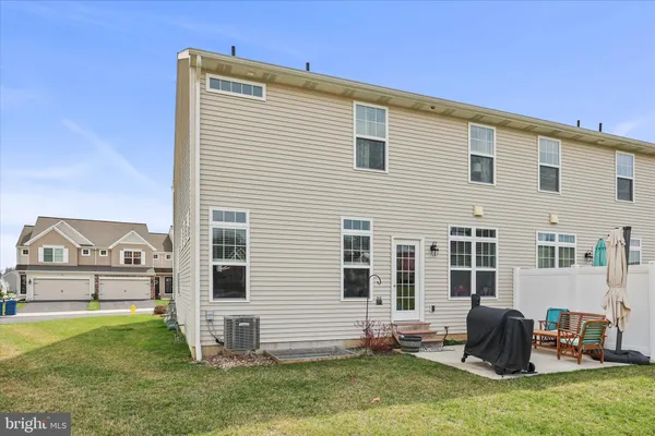 a view of house with garden and deck