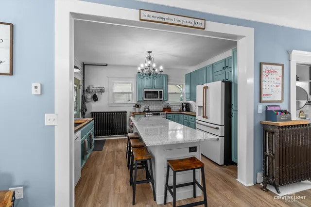 a kitchen with refrigerator and window
