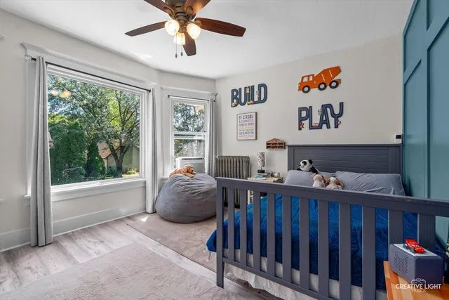 a bedroom with furniture and a window