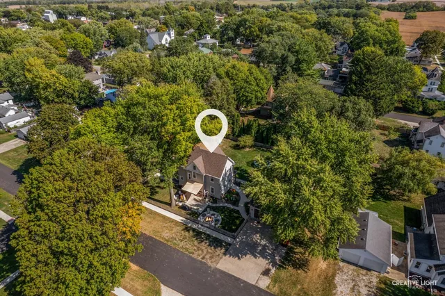 an aerial view of a house with a yard