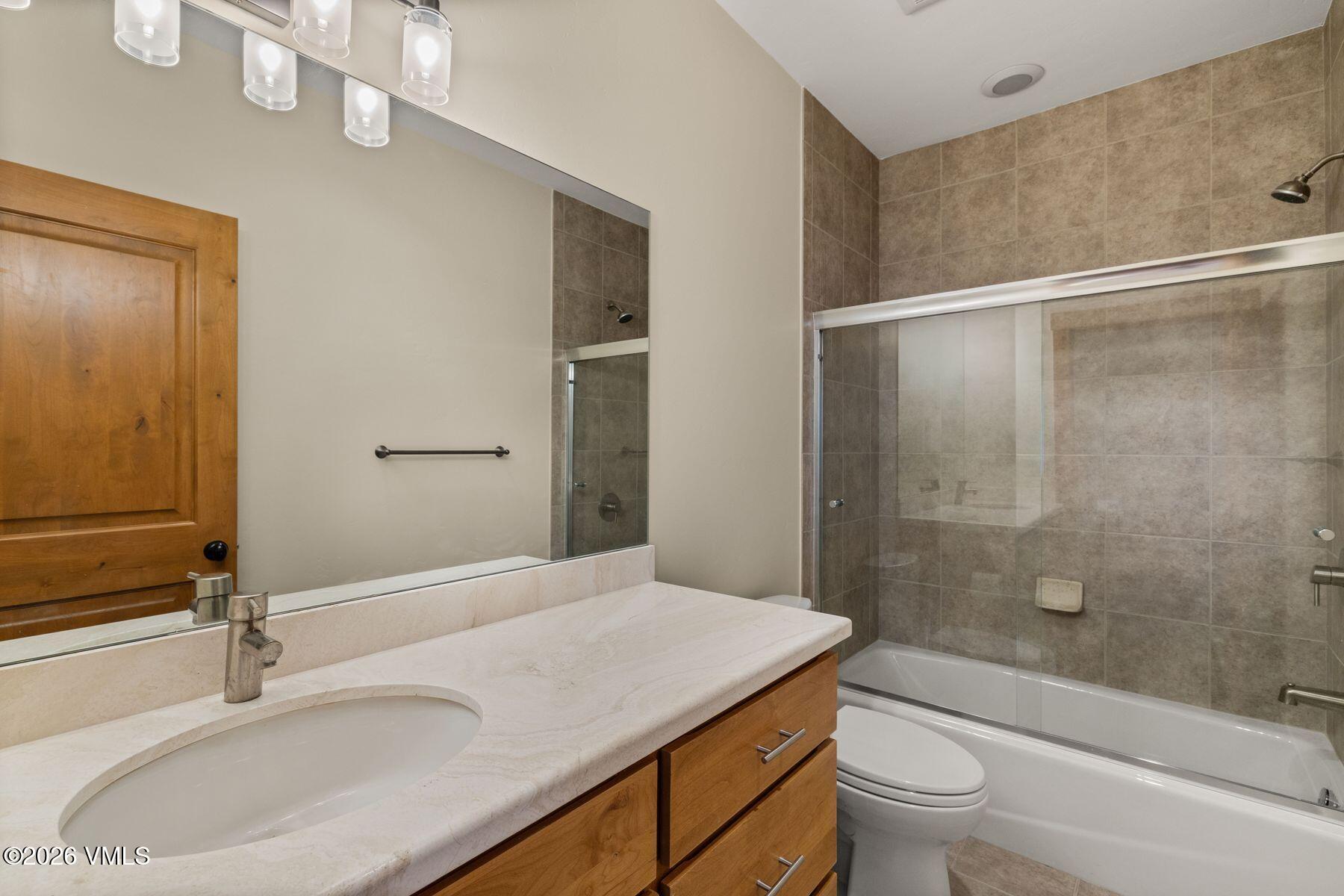 1015 West Wildwood Road, Unit F Avon, CO 81620 - Photo 27 of 35 a bathroom with a sink and a mirror