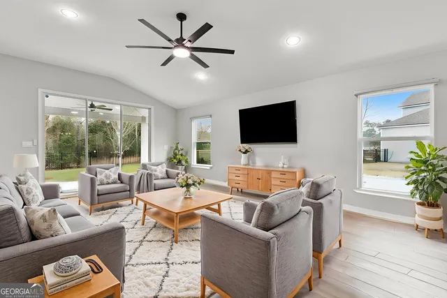 a kitchen with a sink a counter top space stainless steel appliances and cabinets