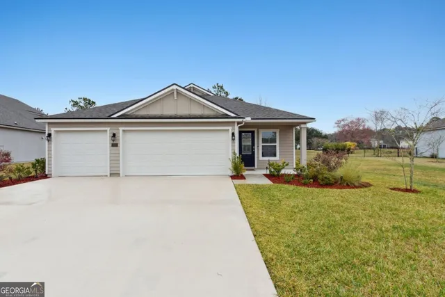 front view of a house with a yard