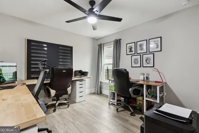 a view of a patio with a table and chairs
