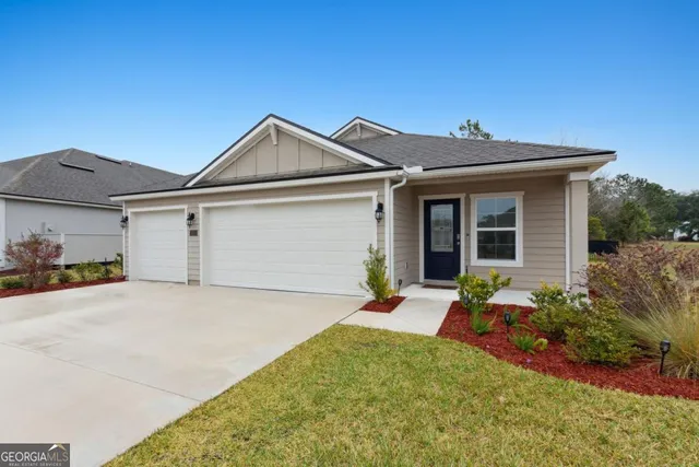 a front view of a house with a yard and porch