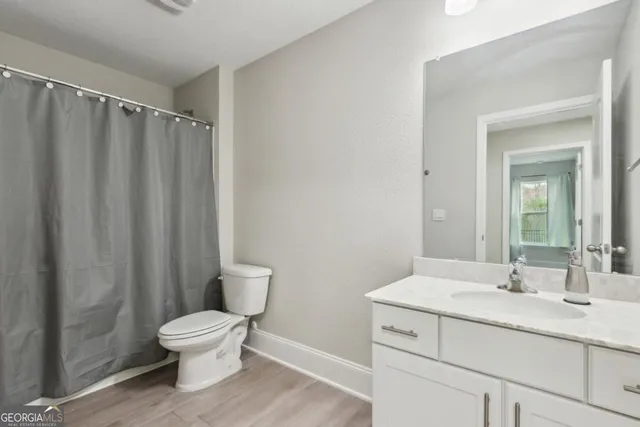 a view of a house with backyard and porch