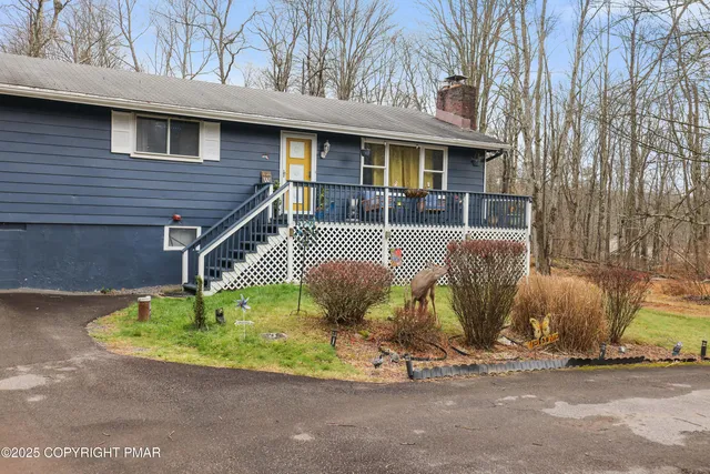 a view of a patio with iron fence