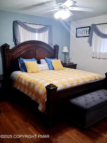 a bathroom with a toilet a sink and a mirror