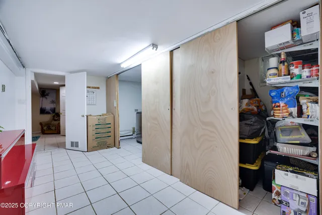 a bed room with a bed and a chandelier