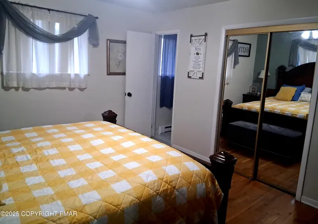 a backyard of a house with wooden floor and outdoor seating