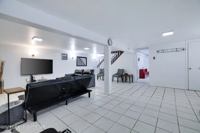 a bathroom with a granite countertop sink a toilet and shower