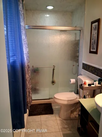 a view of a backyard with large trees