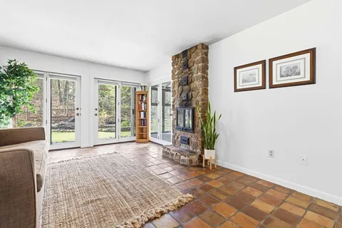 a view of a livingroom with furniture and entryway