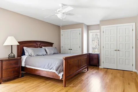 a bedroom with a bed and a lamp