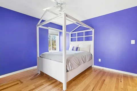 a bed room with a bed and a window
