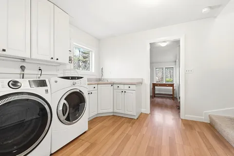 a view of a kitchen with washer and dryer