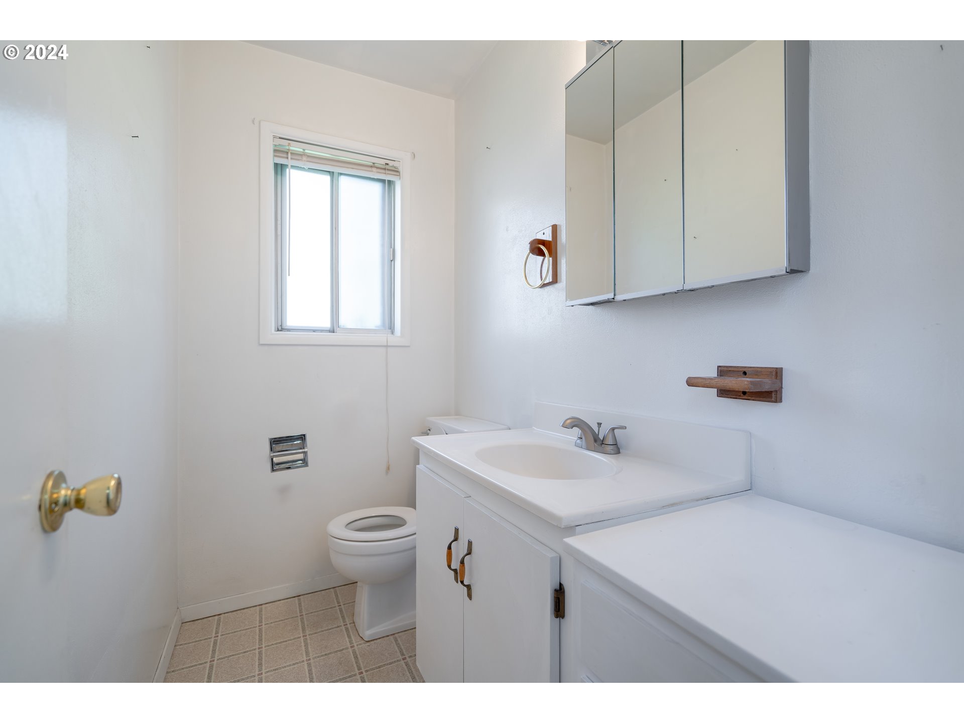 944 Filbert Lane Springfield, OR 97478 - Photo 11 of 24 a bathroom with a sink a toilet and vanity
