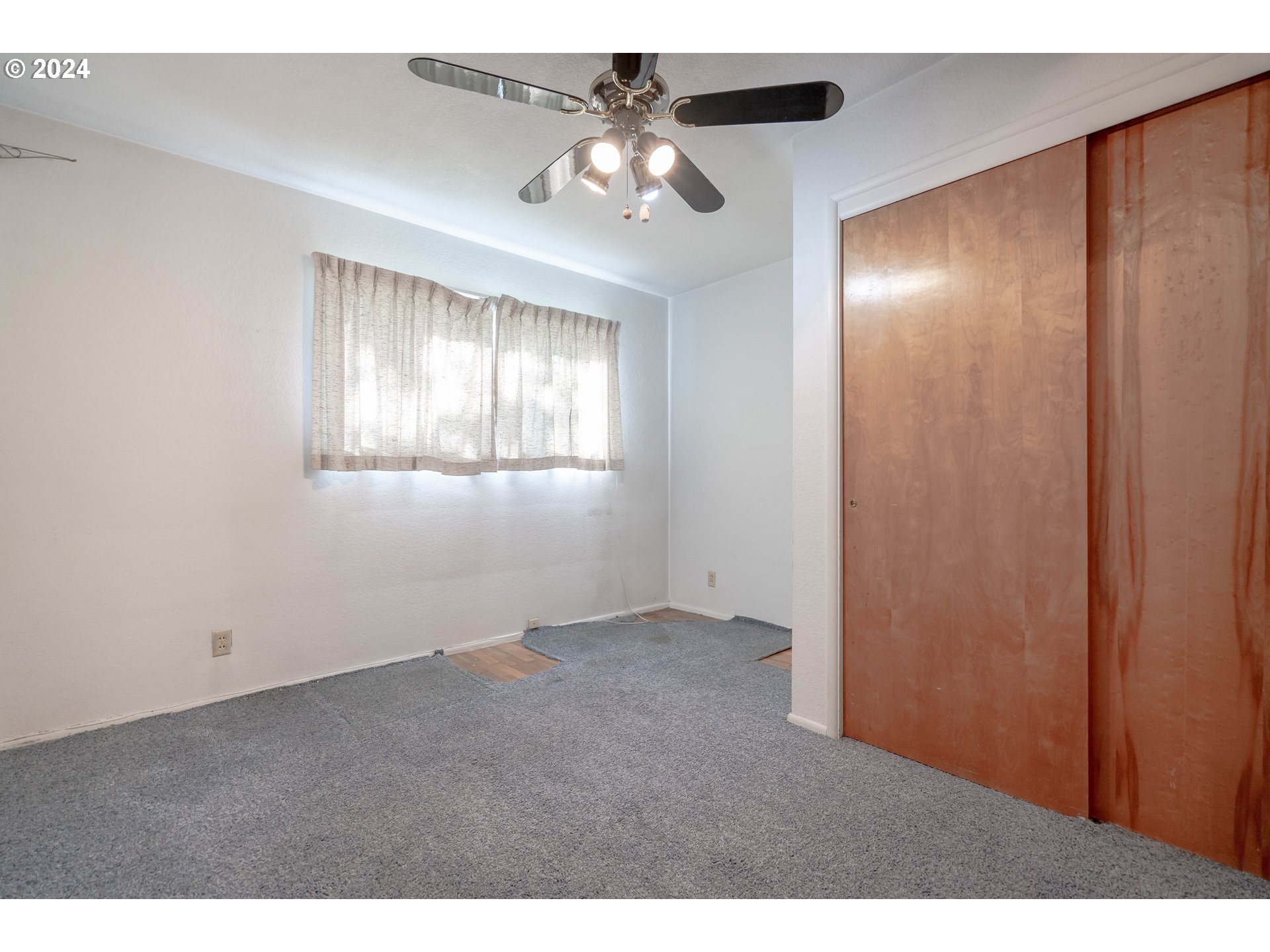 944 Filbert Lane Springfield, OR 97478 - Photo 14 of 24 a view of an empty room with a window