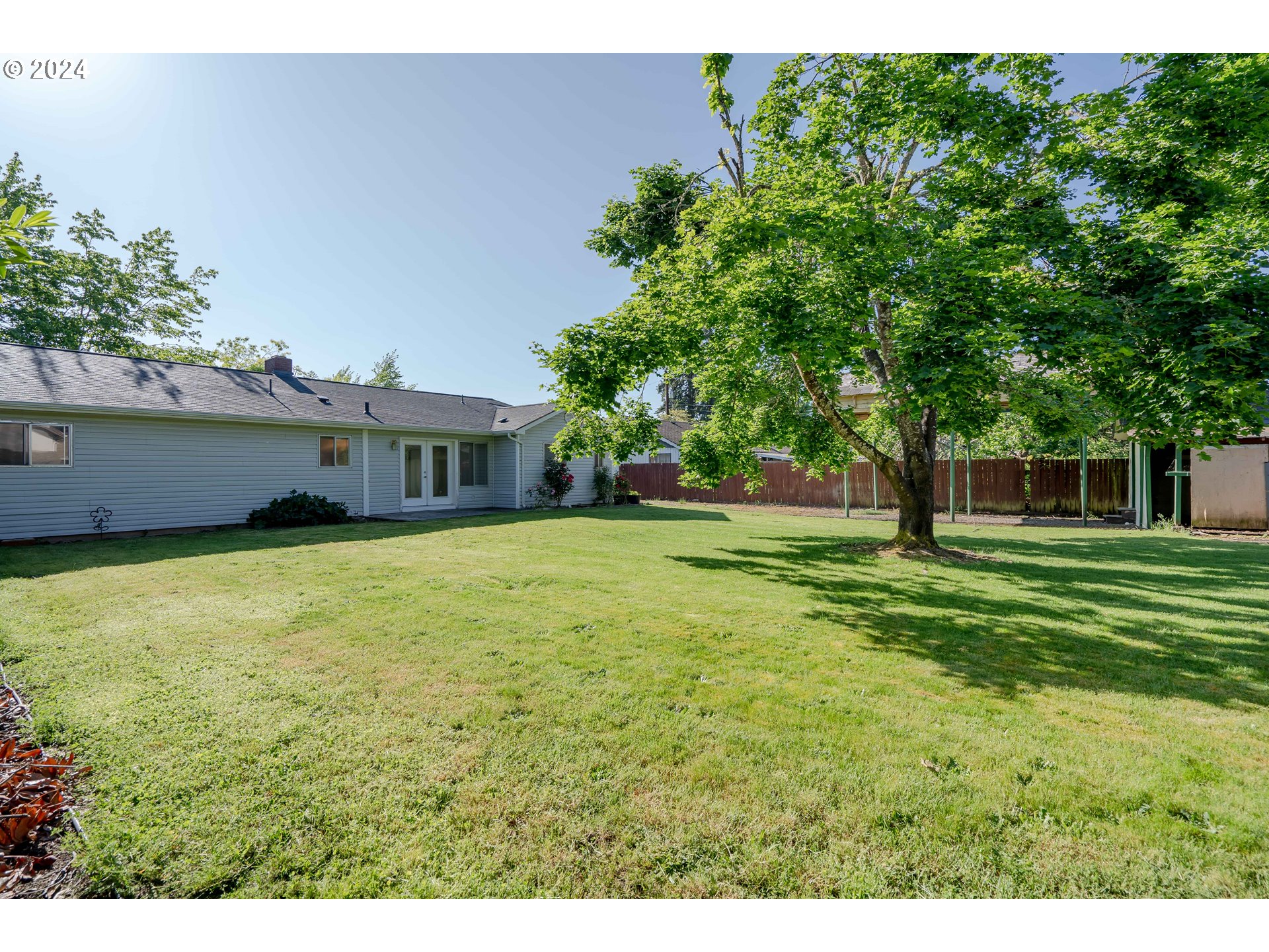944 Filbert Lane Springfield, OR 97478 - Photo 24 of 24 a front view of a house with a garden
