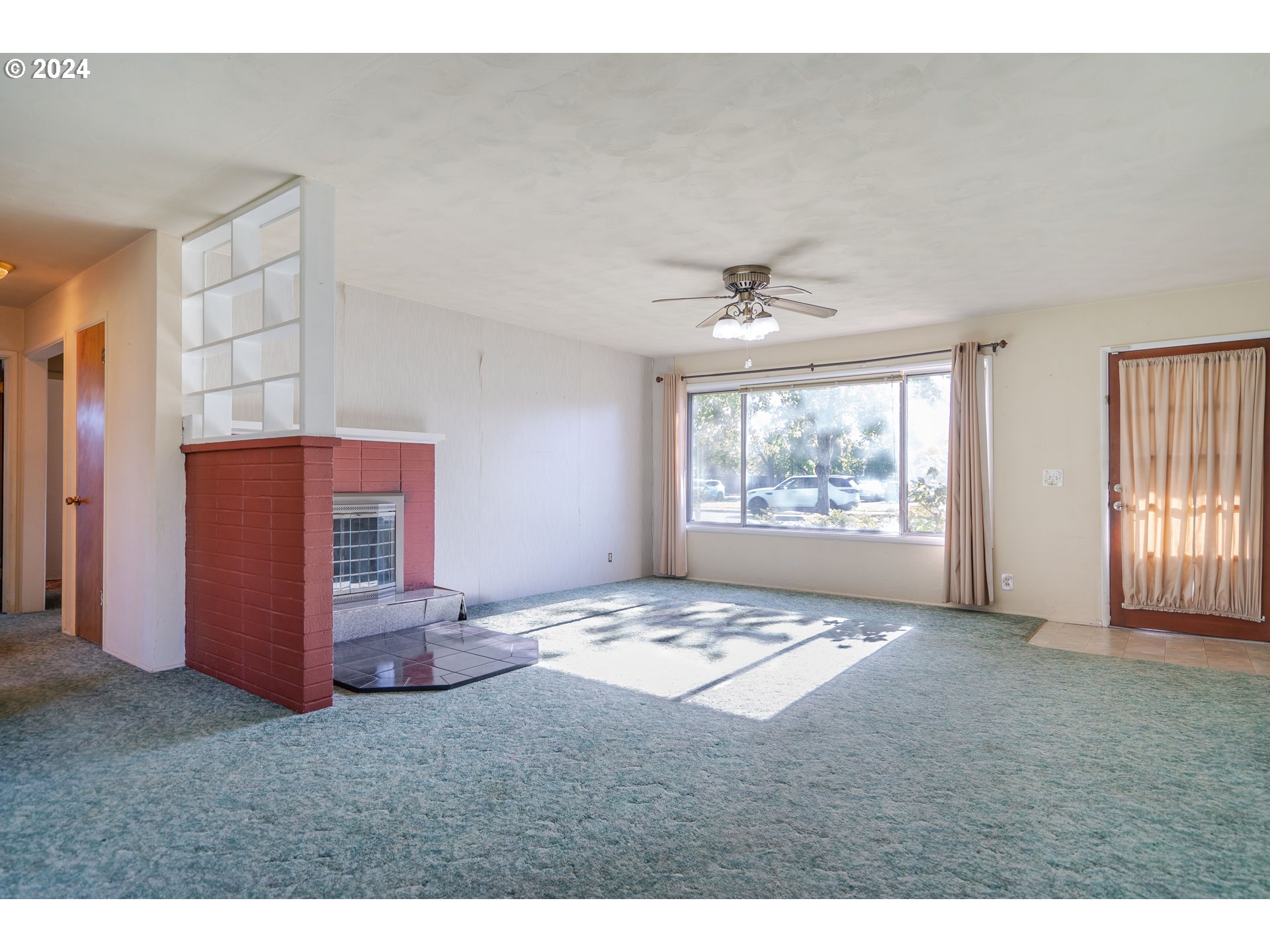 944 Filbert Lane Springfield, OR 97478 - Photo 5 of 24 a view of an empty room with windows
